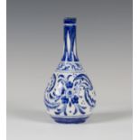 A Doulton Lambeth Persian Ware bottle vase, 1920-36, the pear shaped white glazed body painted in