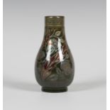 A Pilkington's Royal Lancastrian lustre pottery vase, circa 1910, the pear shaped body decorated