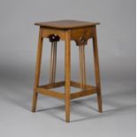 An Edwardian Arts and Crafts oak canted square occasional table, in the manner of Wylie & Lochhead