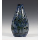 A C.H. Brannam Barum pottery vase, dated 1899, decorated by James Dewdney, monogrammed, the blue and