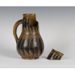 A Martin Brothers stoneware jug, late 19th/early 20th century, the tapering body incised with two