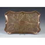 A late 19th/early 20th century Arts and Crafts copper shaped rectangular tray, worked with overall