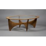 A mid-20th century G Plan teak oval coffee table, designed by Victor Wilkins, the top inset with