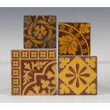 Four Victorian encaustic tiles, comprising a section tile by Maw & Co, with leaf design, 11cm x