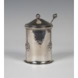 An Arts and Crafts silver preserve pot and spoon by A.E. Jones, the lid and spoon with bud shaped