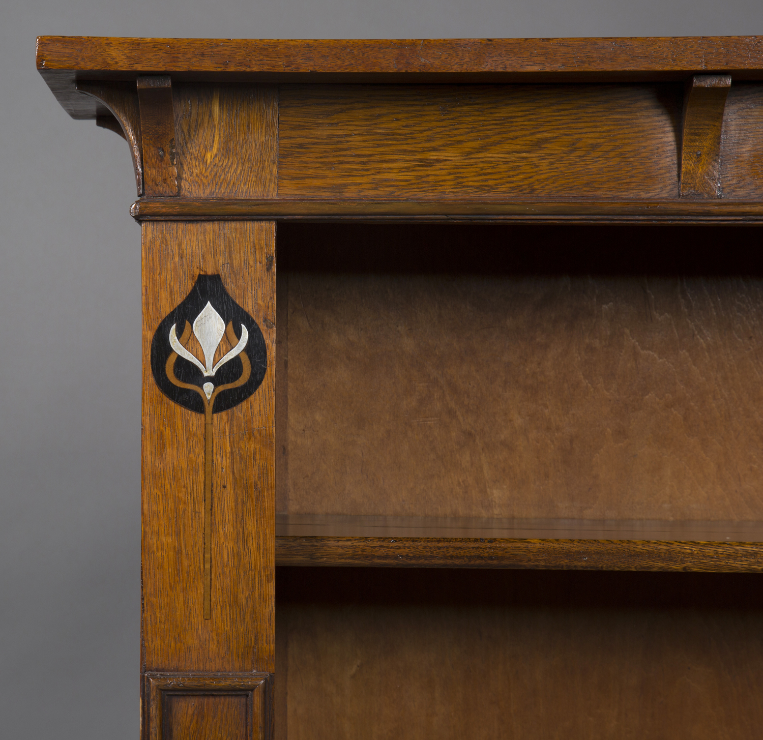 An Edwardian Arts and Crafts oak open bookcase, in the manner of Liberty & Co, the canopied top - Image 4 of 4