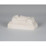 Eduardo Paolozzi - a cast plaster model of a racing car, the underside signed, dated 1997 and