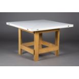 A late 20th century white melamine and beech folding envelope dining table, probably retailed by The