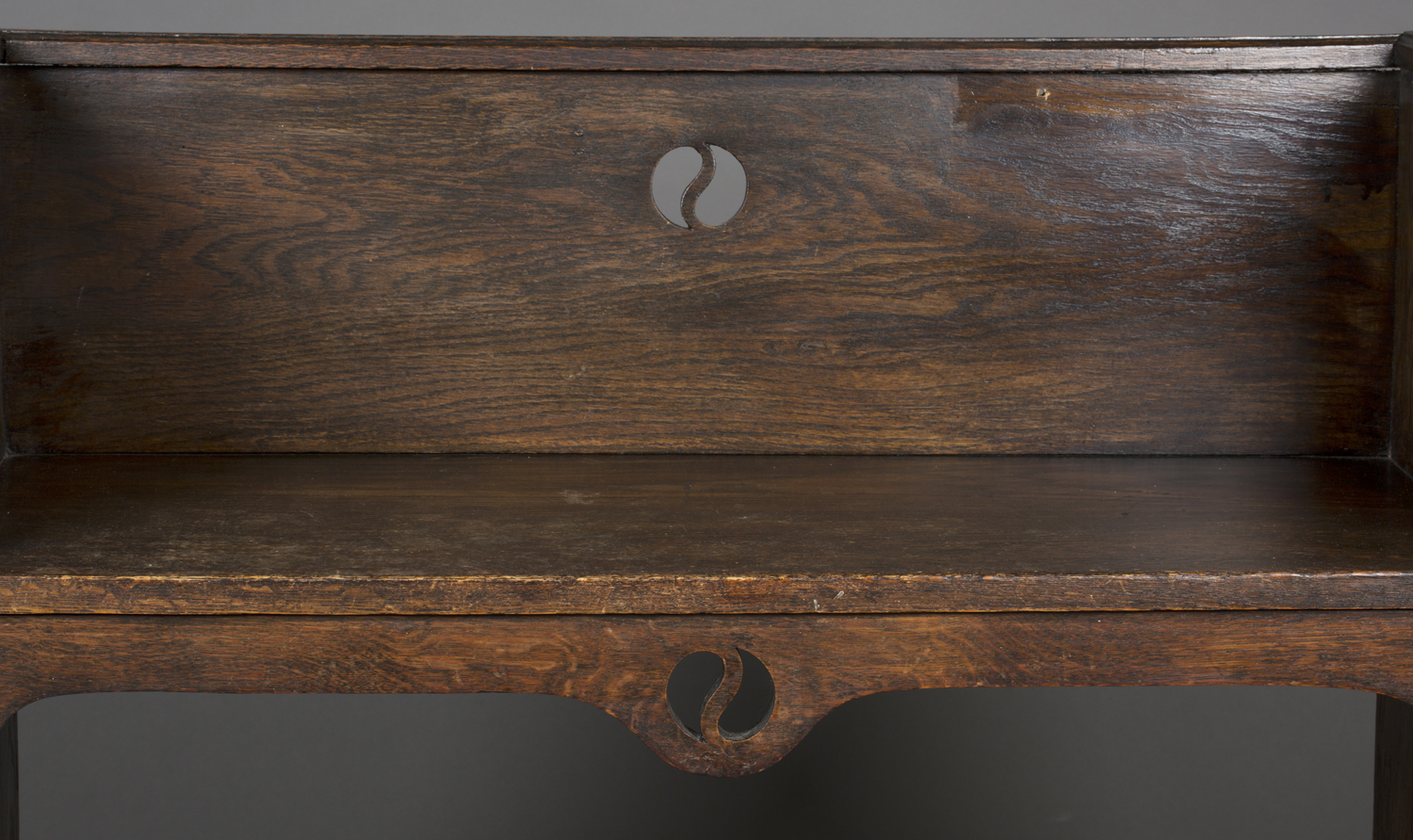 An early 20th century Arts and Crafts style stained oak hall bench, possibly by Liberty & Co, the - Image 2 of 4