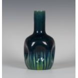A Linthorpe pottery vase, late 19th century, designed by Christopher Dresser, the dimpled body