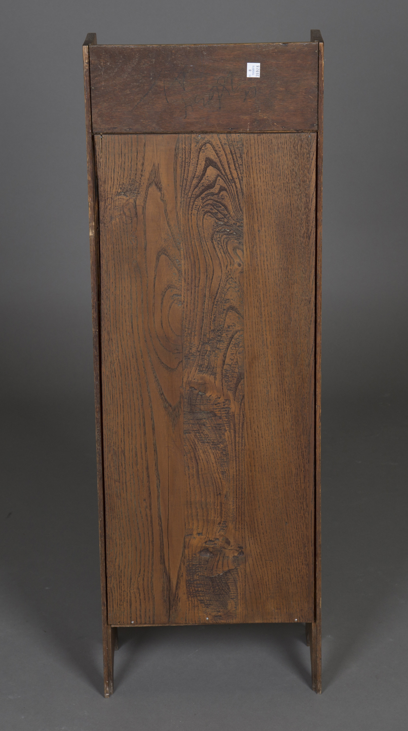 An early 20th century Arts and Crafts oak narrow bookcase, in the manner of Liberty & Co, fitted - Image 3 of 3