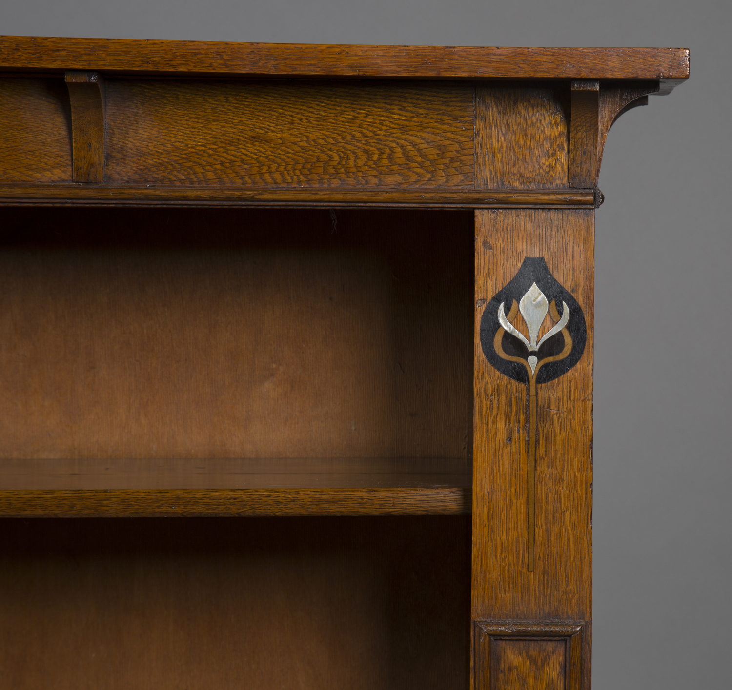 An Edwardian Arts and Crafts oak open bookcase, in the manner of Liberty & Co, the canopied top - Image 3 of 4