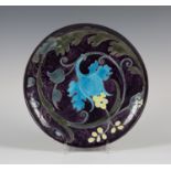 A Theodore Deck tubelined pottery plate, late 19th century, decorated with Art Nouveau style