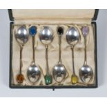 A set of six Liberty & Co silver coffee spoons, each handle with a hardstone terminal, Birmingham