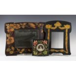A group of early 20th century stained and coloured penwork items, comprising a shaped mirror
