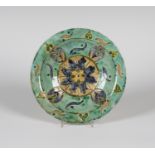A small Della Robbia pottery dish, dated 1895, decorated by Annie Smith, monogrammed, with