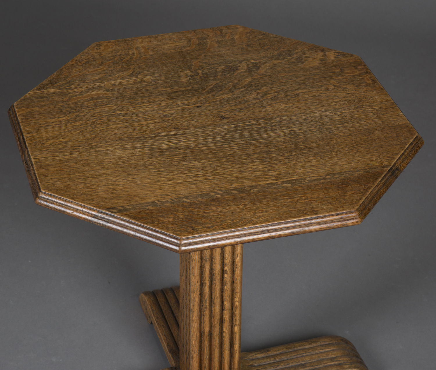 An early 20th century Heals style oak octagonal occasional table, the moulded top above a reeded - Image 2 of 2