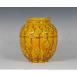 A Burmantofts Faience art pottery vase, 1880s, the ochre glazed ovoid body relief decorated with a