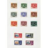 A collection of British Commonwealth stamps, used on album leaves, including Bermuda 1920
