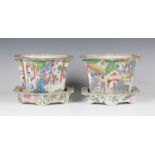 A pair of Chinese Canton famille rose porcelain hexagonal jardinières and stands, mid-19th