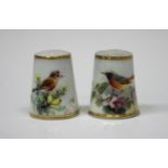 Two Royal Worcester porcelain thimbles, circa 1935, painted by Powell, signed, with birds, puce