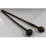 A Zulu hardwood knobkerrie with a rounded bulbous head, length 65cm, together with another similar
