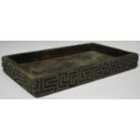 A Chinese hardwood rectangular tray, late Qing dynasty, the sides carved with a keyfret frieze,