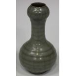 A Chinese Guan-type celadon crackle glazed vase, Song style but later, the ribbed globular body with