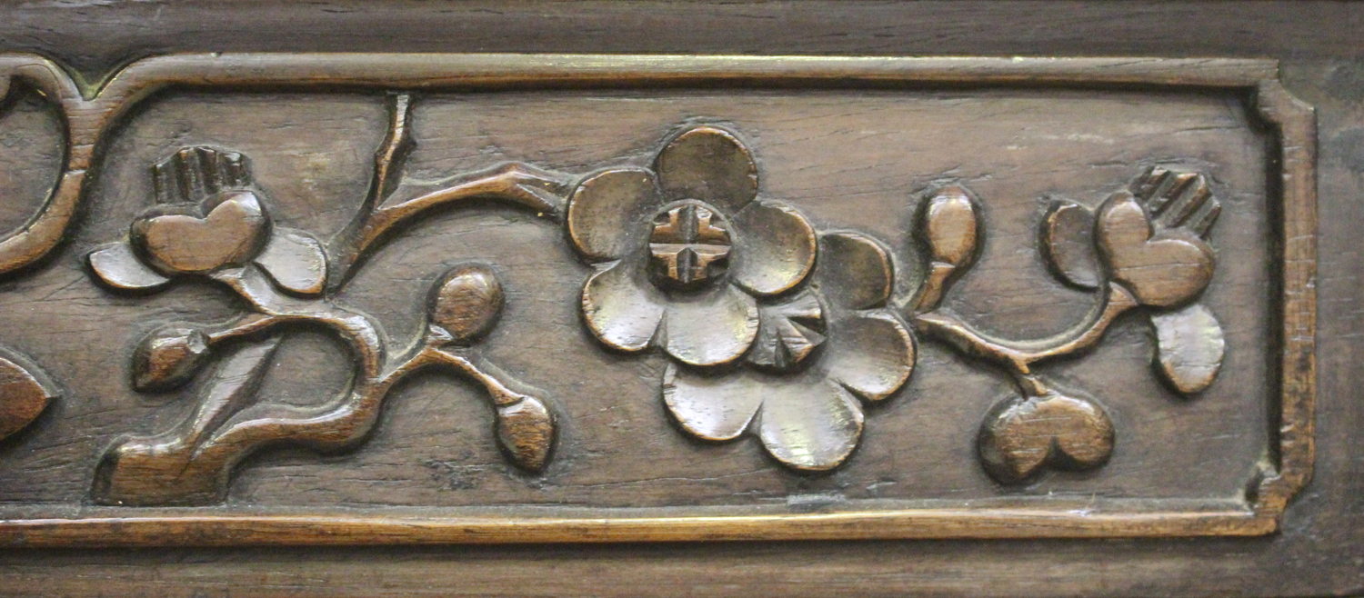 A Chinese hardwood writing desk with carved blossoming prunus decoration, late 19th century, the - Image 8 of 14