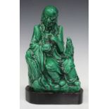 A Chinese green glazed pottery figure of a bodhisattva, probably 20th century, modelled seated on