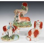 Three pieces of Staffordshire pottery, mid to late 19th century, comprising a deer spill vase group,