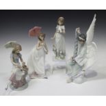 Four Lladro porcelain figures, comprising Angel with Garland, model No. 6133, Picture Perfect, model