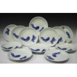A set of twelve Hirado blue and white porcelain saucer dishes, Meiji period, decorated with two