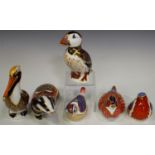 Six Royal Crown Derby paperweights, comprising Moonlight Badger, Brown Pelican, Puffin, Goldcrest,