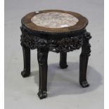 A Chinese hardwood stand, late 19th/early 20th century, the top inset with a rouge marble panel