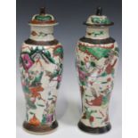 A pair of Chinese famille rose crackle glazed vases and covers, early 20th century, each baluster