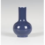 A Chinese blue glazed porcelain bottle vase, mark of Qianlong but probably later, the globular
