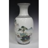 A Chinese Republic style porcelain vase, late 20th century, painted with a landscape, printed red