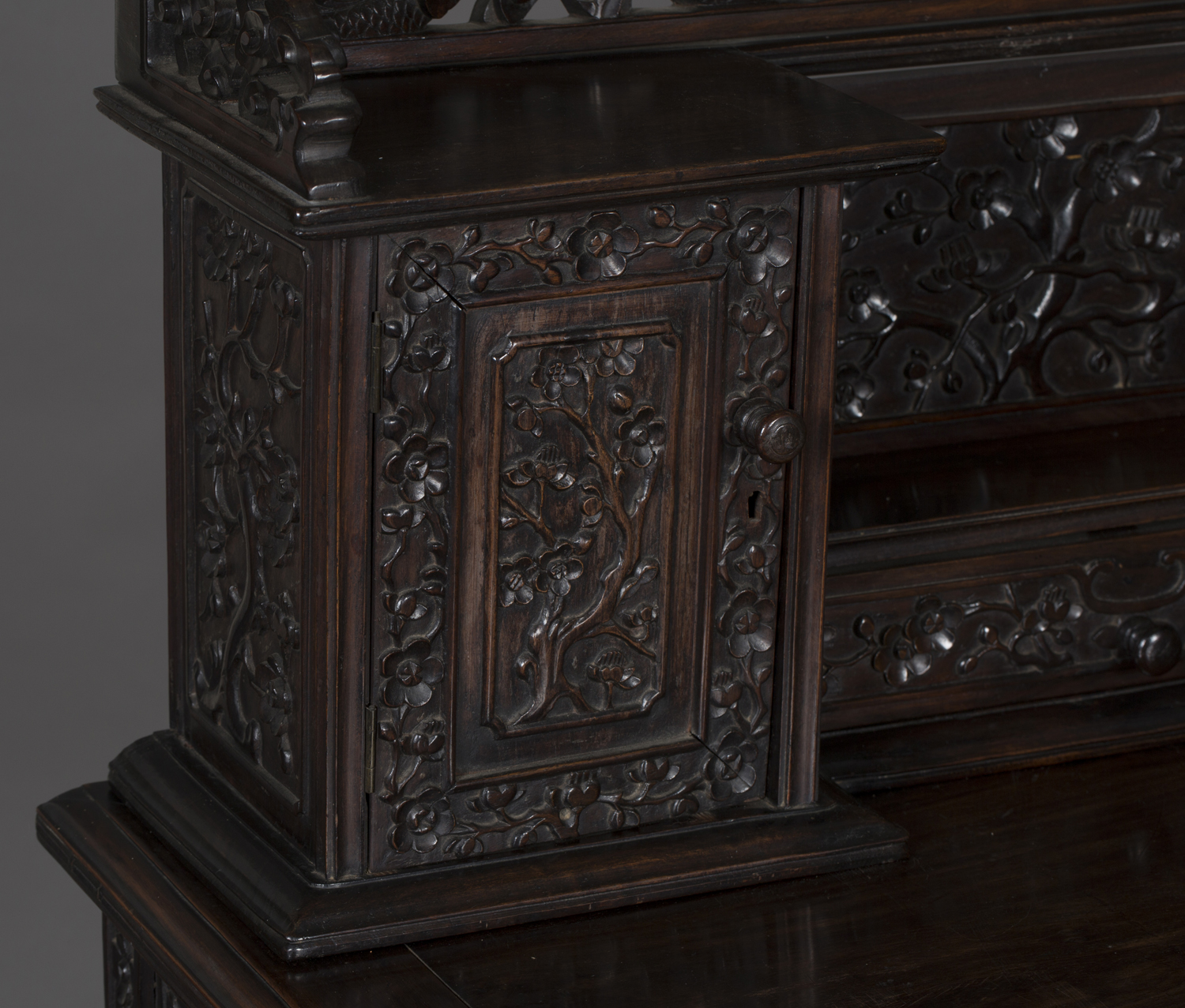 A Chinese hardwood writing desk with carved blossoming prunus decoration, late 19th century, the - Image 12 of 14