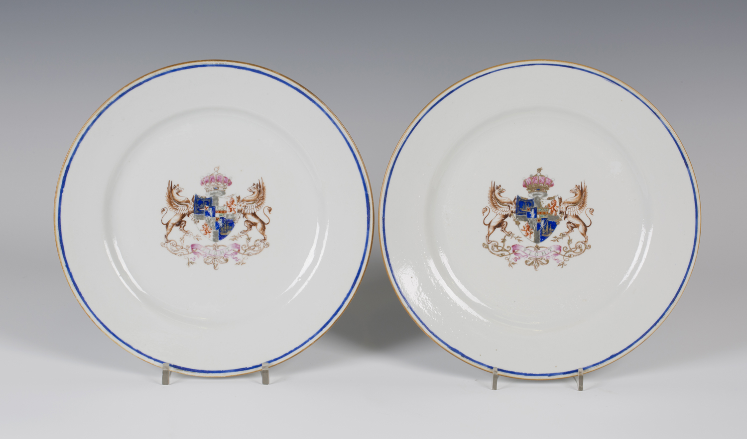 A pair of Chinese armorial porcelain plates, 19th century, each centre enamelled and gilt with a