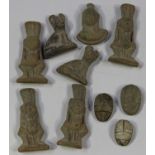 A group of seven ancient terracotta amulet figures, four formed as the dwarf god Bes, height 4.