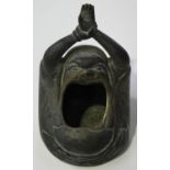 A Japanese bronze handwarmer/pot, Meiji/Taisho period, modelled in the form of Daruma with yawning