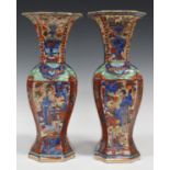 A pair of Chinese 'clobbered' blue and white porcelain vases, Kangxi period and later, each