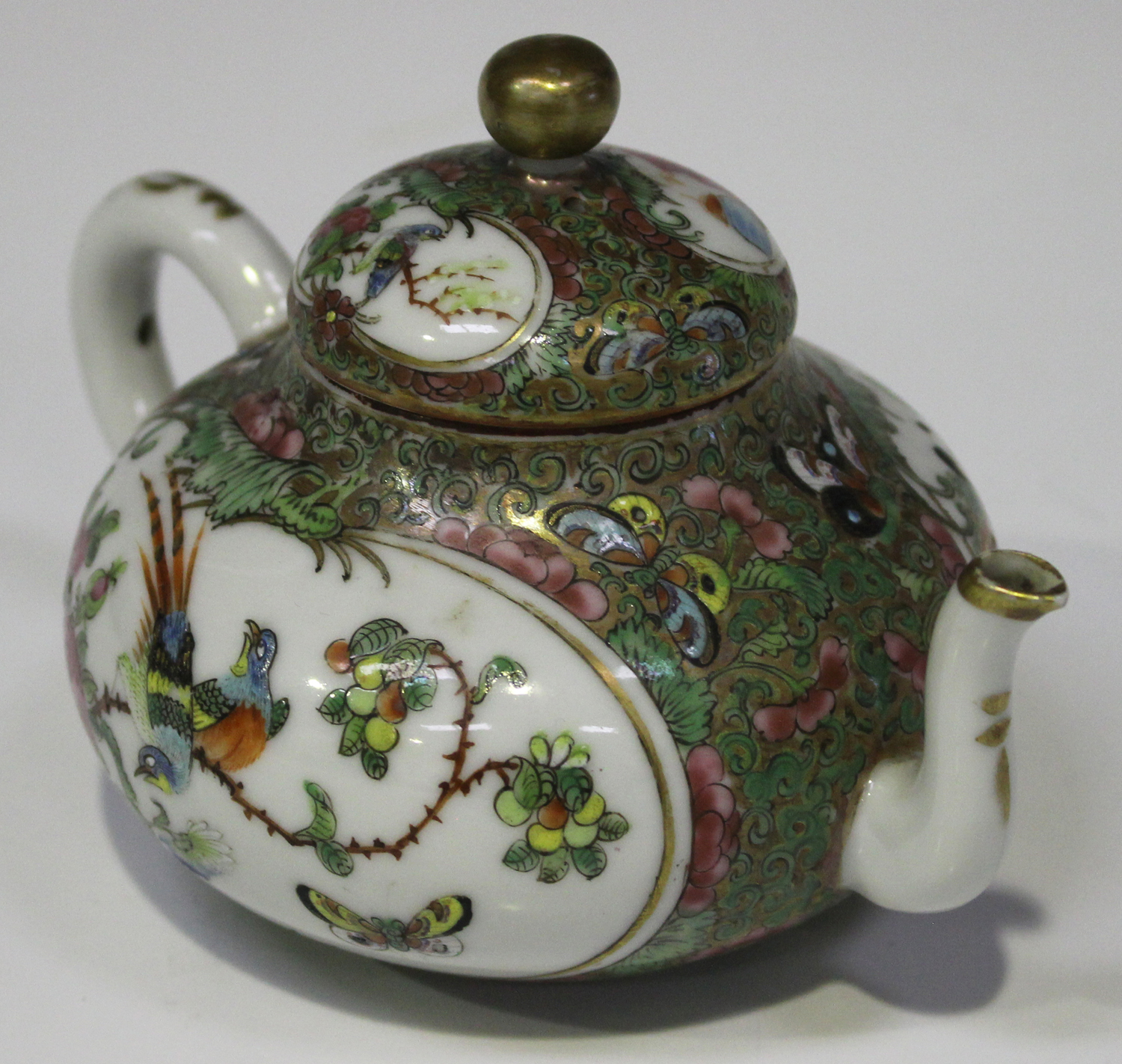 A Chinese Canton famille rose porcelain teapot and cover, mid to late 19th century, of diminutive