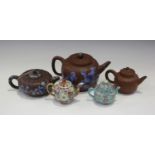 A collection of Chinese pottery teapots, late 19th century and later, including two enamelled Yixing