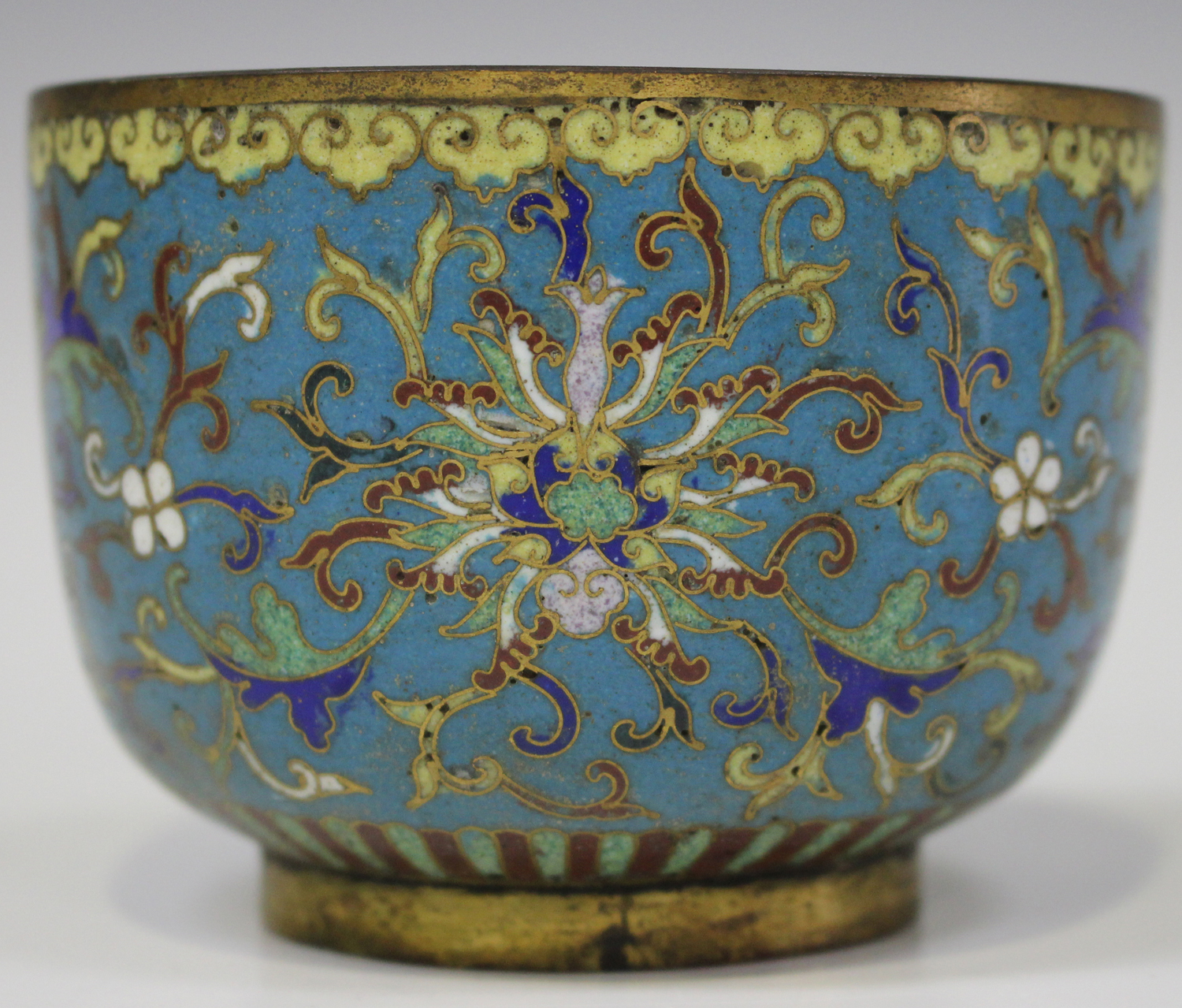 A Chinese cloisonné bowl, 19th century, of circular 'U' form with gilt copper mounts, the exterior