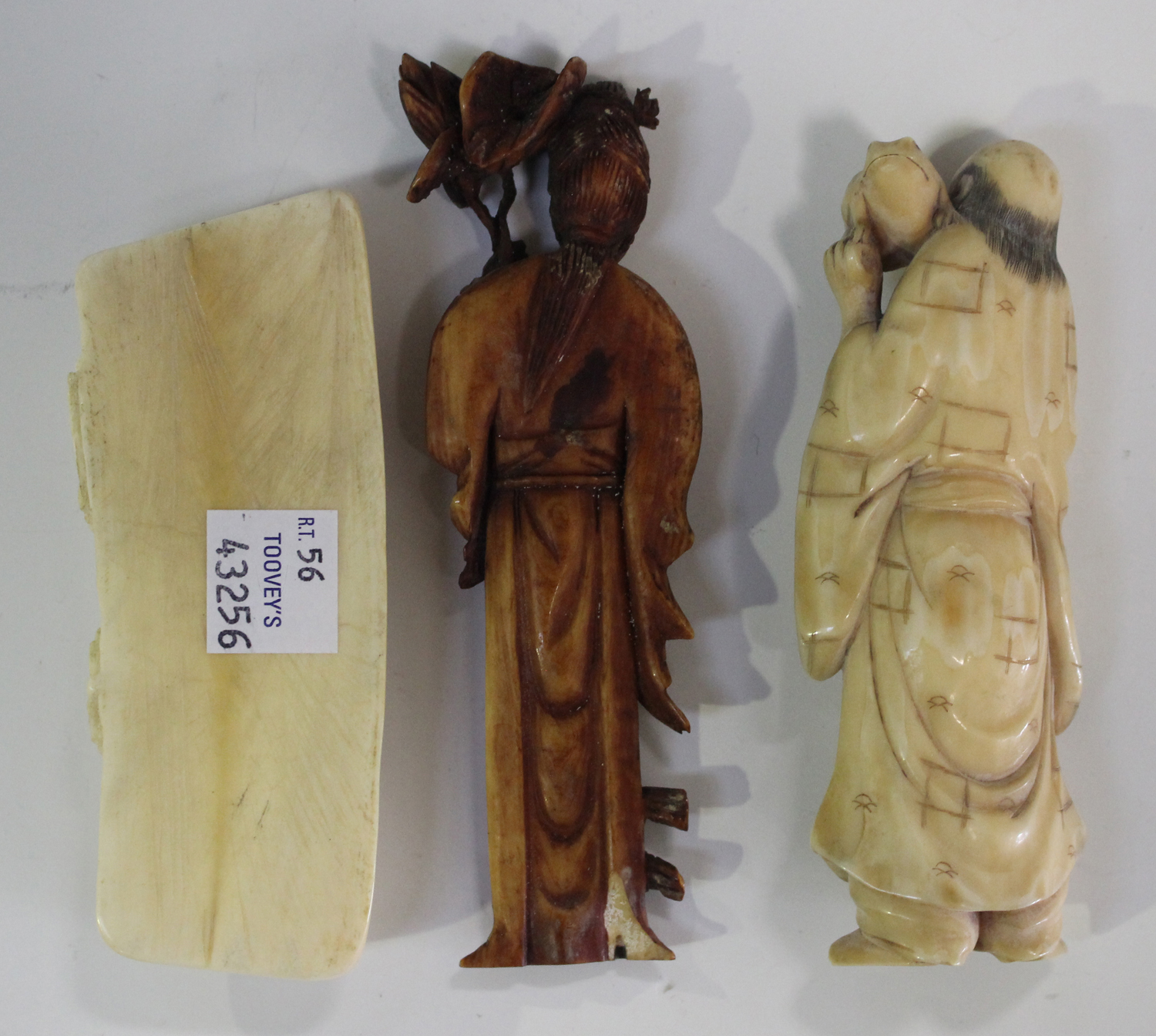 A Chinese brown stained ivory figure of a maiden, late Qing dynasty, modelled standing holding a - Image 3 of 4