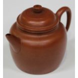 A Chinese Yixing stoneware diminutive teapot and cover, probably 20th century, of swollen