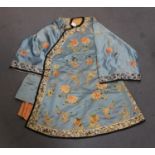 A Chinese blue silk embroidered jacket/short robe, late Qing dynasty, finely worked in coloured