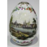 A Continental porcelain egg, 19th century, painted with a view of Meissen and the River Elbe
